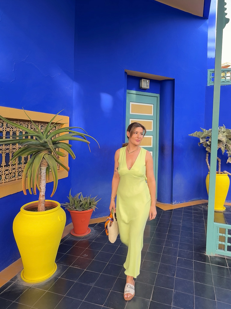 Exploring the vibrant blue walls of Jardin Majorelle, a stunning garden oasis in Marrakech.