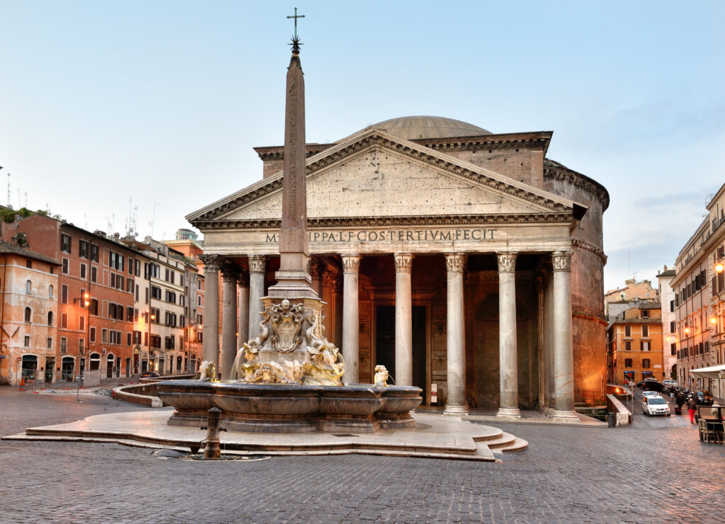 The Pantheon in Rome at sunrise, showcasing its grand columns and the Fontana del Pantheon in Piazza della Rotonda.