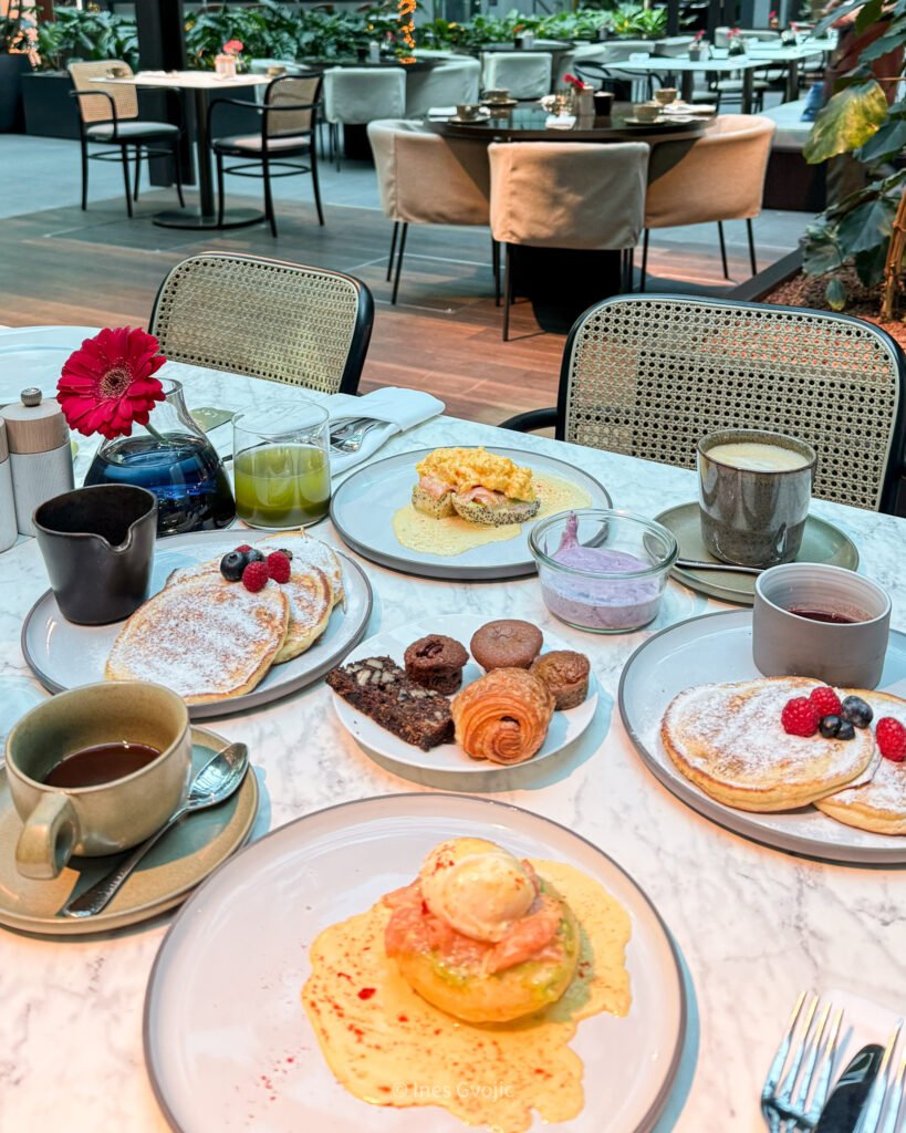 Table with breakfast dishes at Pavilion restaurant in Dorothea Hotel Budapest