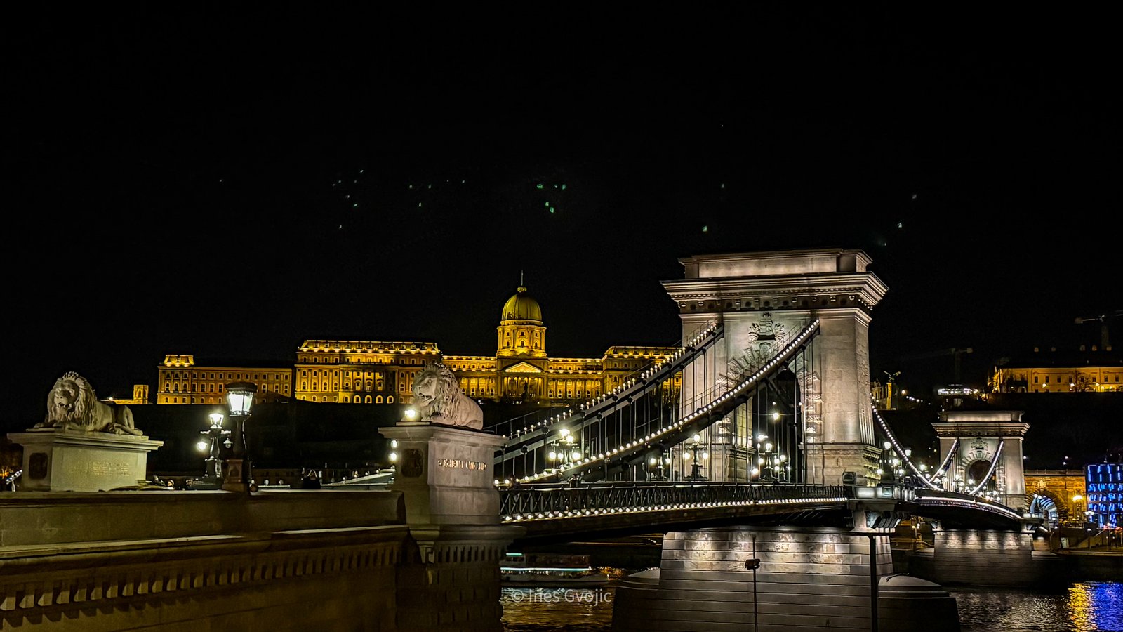 Chain Bridge and Buda Castle illuminated at night in Budapest