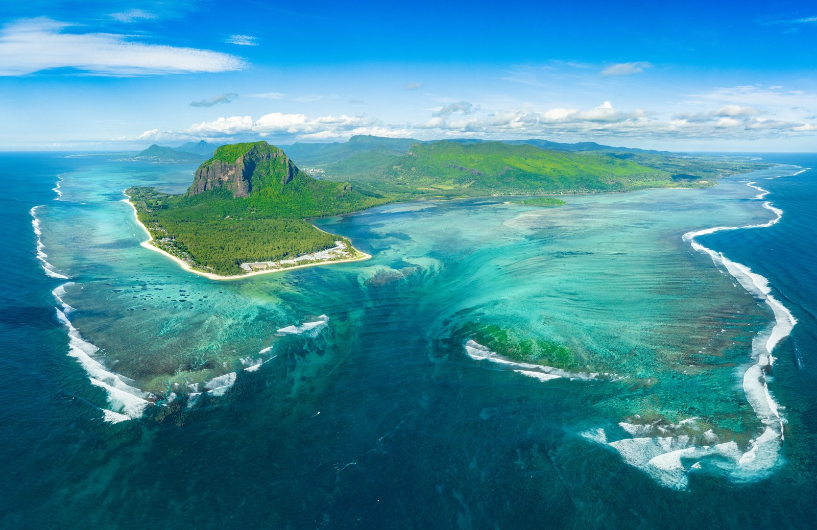 Aerial shot of Mauritius' underwater waterfall illusion near Le Morne peninsula.