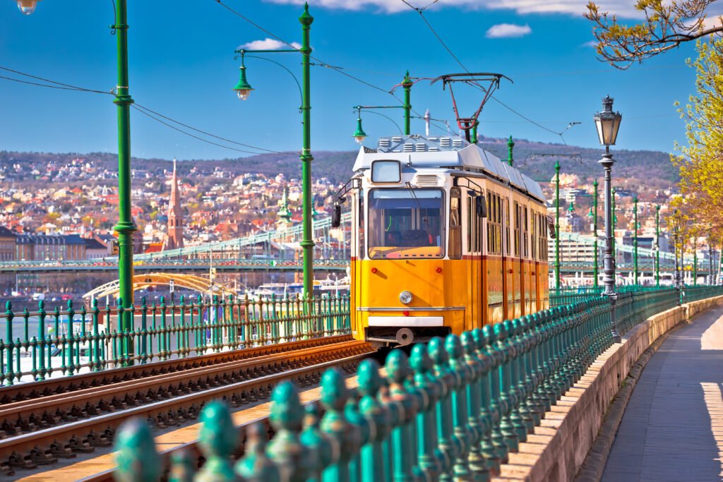 Iconic yellow tram in Budapest near the Danube River