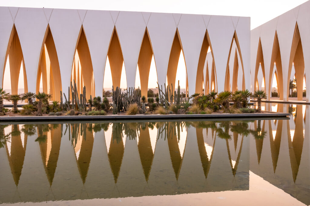 El Gouna Conference and Culture Center with dramatic arches, cactus garden, and reflecting pool, El Gouna resort, Egypt, North Africa.
